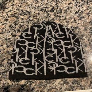 black knit beanie with an all-over CK